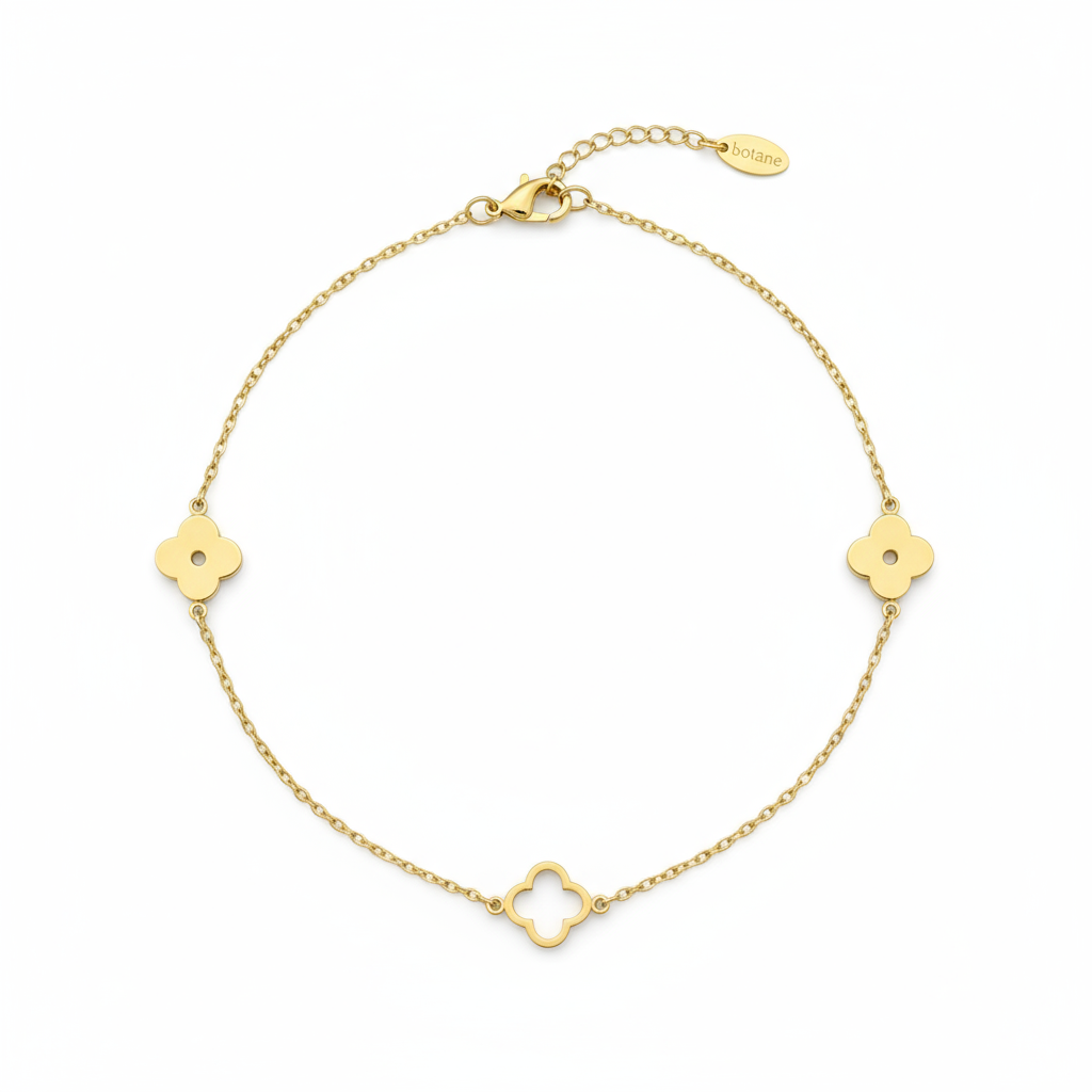 Gold necklace with clover-shaped pendants on a white background